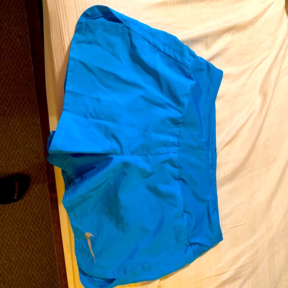 Blue Nike DRI-fit running shorts